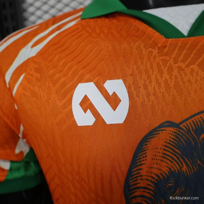 Player Version 2025 Ivory Coast Orange with Elephant Graphic and Green Accents Jersey